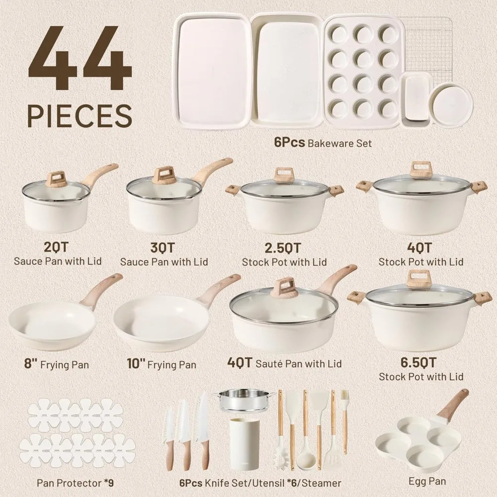Set of cookware pieces including pots, pans, and bakeware on a neutral background